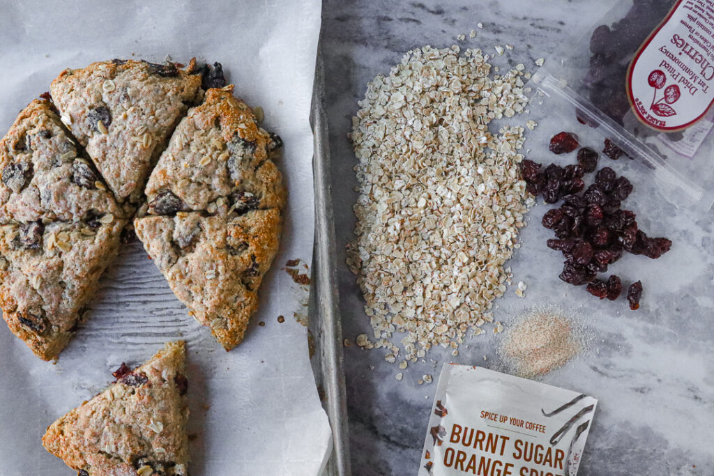 showcase of ingredients for cherry oat scones: dried cherries, oatmeal and orange sugar