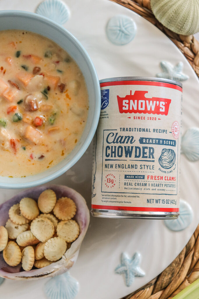 bowl of chowder alongside can of chowder with oyster crackers
