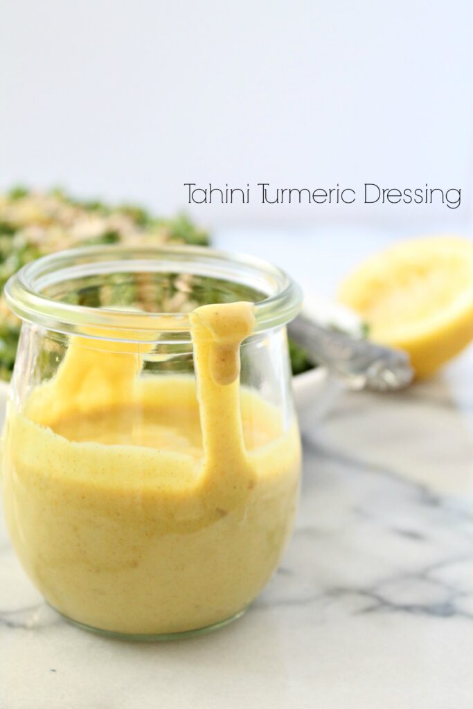 Recreate this unique and delicious Tahini Turmeric Dressing at home and dress kale, grains, and your arugula with it! - Recipe on CookingWithBooks.net